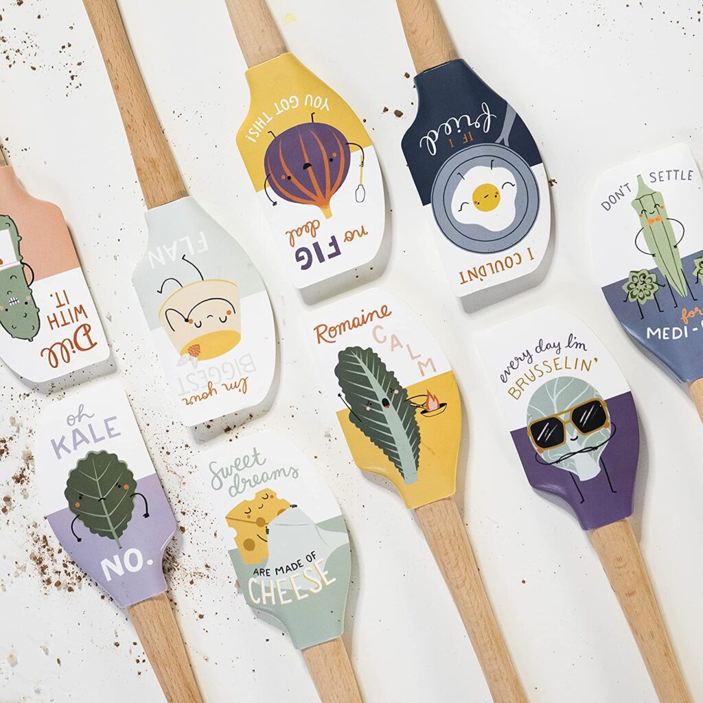 Various rubber spatulas all featuring food puns