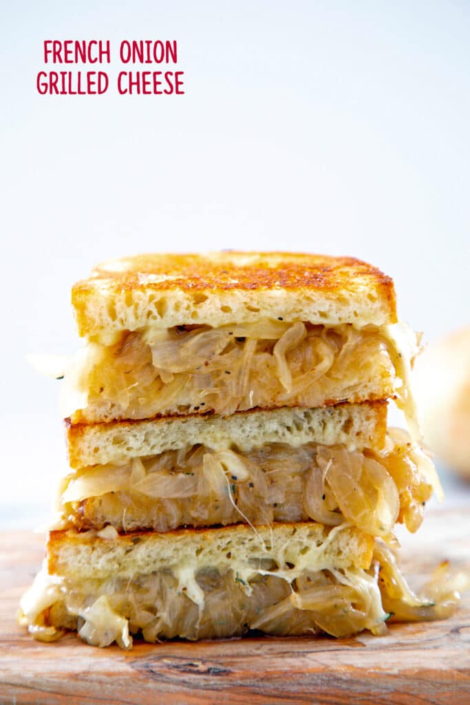 Head-on view of french onion grilled cheese sandwich halves stacked on each other with recipe title at top