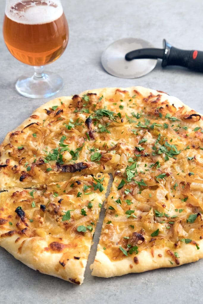 French Onion Soup Pizza -- If you're craving a big bowl of french onion soup, try it in pizza form instead! This pizza takes all the elements of the classic soup and turns it into a meal | wearenotmartha.com