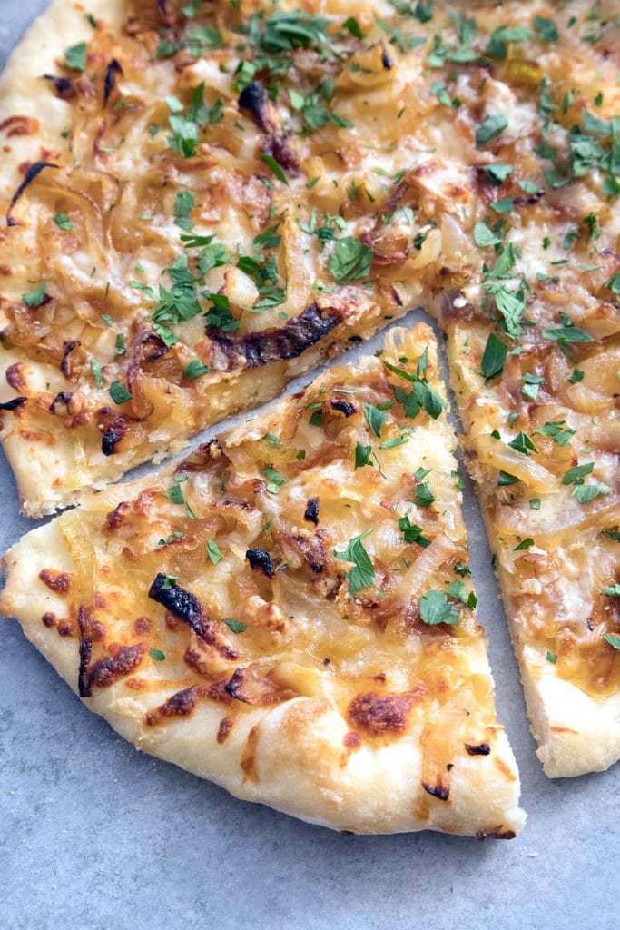 French Onion Soup Pizza -- If you're craving a big bowl of french onion soup, try it in pizza form instead! This pizza takes all the elements of the classic soup and turns it into a meal | wearenotmartha.com
