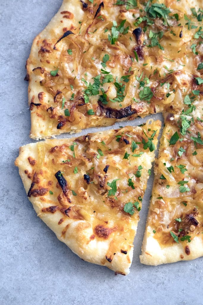 French Onion Soup Pizza -- If you're craving a big bowl of french onion soup, try it in pizza form instead! This pizza takes all the elements of the classic soup and turns it into a meal | wearenotmartha.com