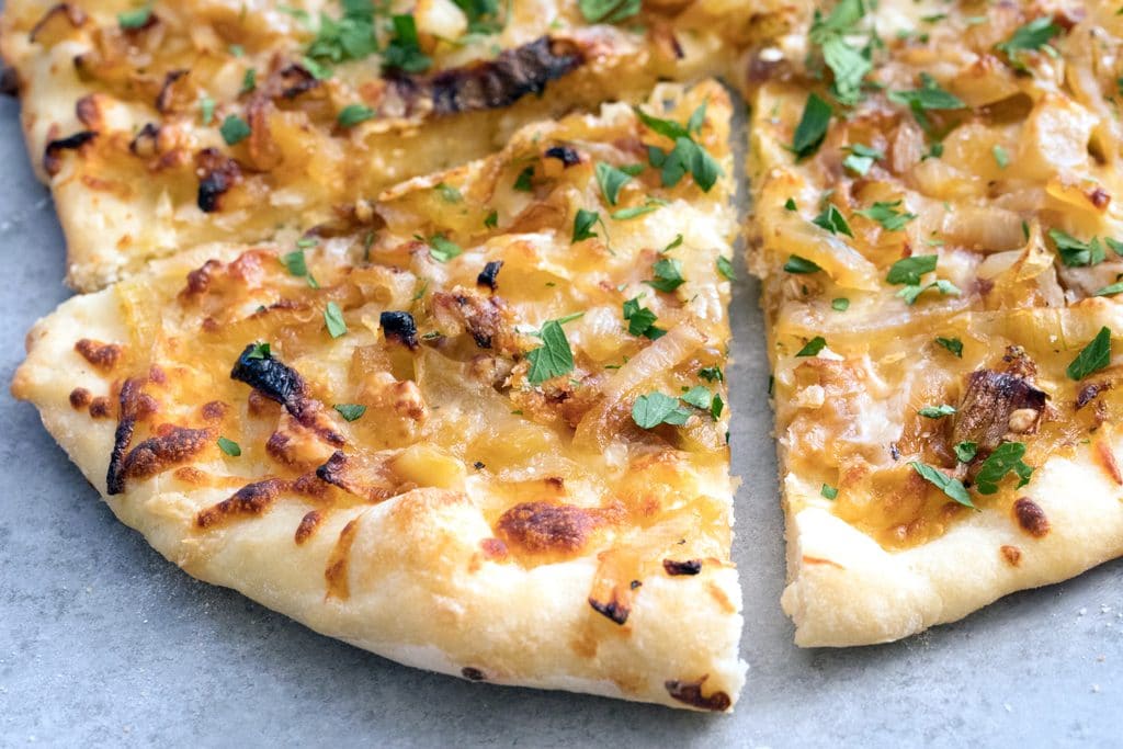 French Onion Soup Pizza -- If you're craving a big bowl of french onion soup, try it in pizza form instead! This pizza takes all the elements of the classic soup and turns it into a meal | wearenotmartha.com