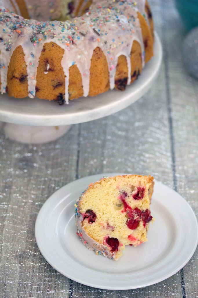 Frosted Vanilla  Cookie Cranberry Bundt Cake -- A classic holiday cake with a sweet twist | wearenotmartha.com