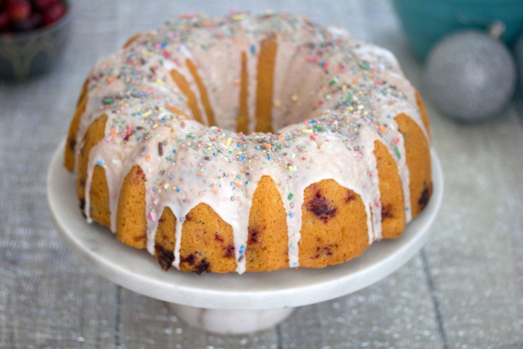 Frosted Vanilla  Cookie Cranberry Bundt Cake -- A classic holiday cake with a sweet twist | wearenotmartha.com