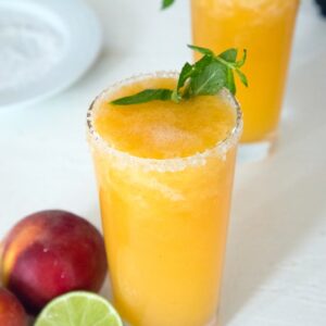 Frozen Peach Margaritas -- These margaritas made with fresh peaches, tequila and honey will become your official summer cocktail | wearenotmartha.com