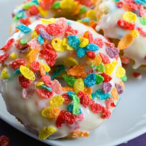 These Fruity Pebbles Doughnuts are the stuff your childhood dreams were made of! But will you enjoy these baked doughnuts topped with sugary cereal for breakfast... Or save them for dessert?