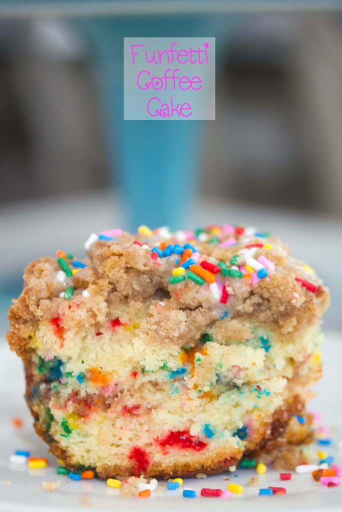 Head-on closeup view of a slice of funfetti coffee cake with crumb topping and rainbow sprinkles with recipe title at top