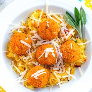 Garlicky Spaghetti Squash with Pumpkin Chicken Meatballs -- Garlicky Spaghetti Squash with Pumpkin Chicken Meatballs is a deliciously healthy fall or winter meal that is so quick and easy to make! | wearenotmartha.com