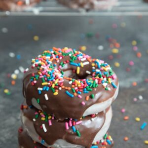 Glazed Coffee Chocolate Frosted Donuts -- If you're going to fry donuts, you may as well go all out and make glazed chocolate frosted donuts. And add in coffee for good measure! | wearenotmartha.com #donuts #doughnuts #chocolate #coffee #sprinkles