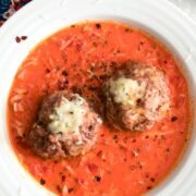 Gorgonzola Meatballs with Creamy Tomato Gravy -- These may just be the most perfect meatballs in the world. Served over a creamy tomato gravy, the only thing missing is a side salad or a loaf of garlic bread | wearenotmartha.com