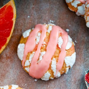 These Grapefruit Crinkle Cookies are a delicious combination of sweet and tart. Top them with a Campari icing drizzle and your favorite cocktail has just been turned into the best cookie ever.