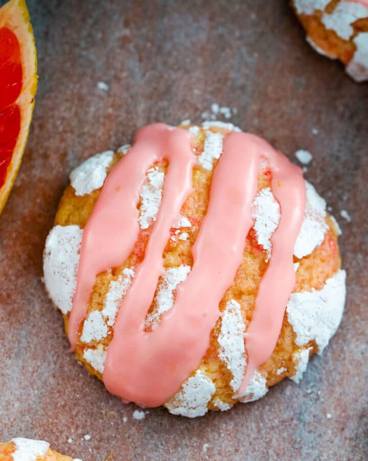 These Grapefruit Crinkle Cookies are a delicious combination of sweet and tart. Top them with a Campari icing drizzle and your favorite cocktail has just been turned into the best cookie ever.