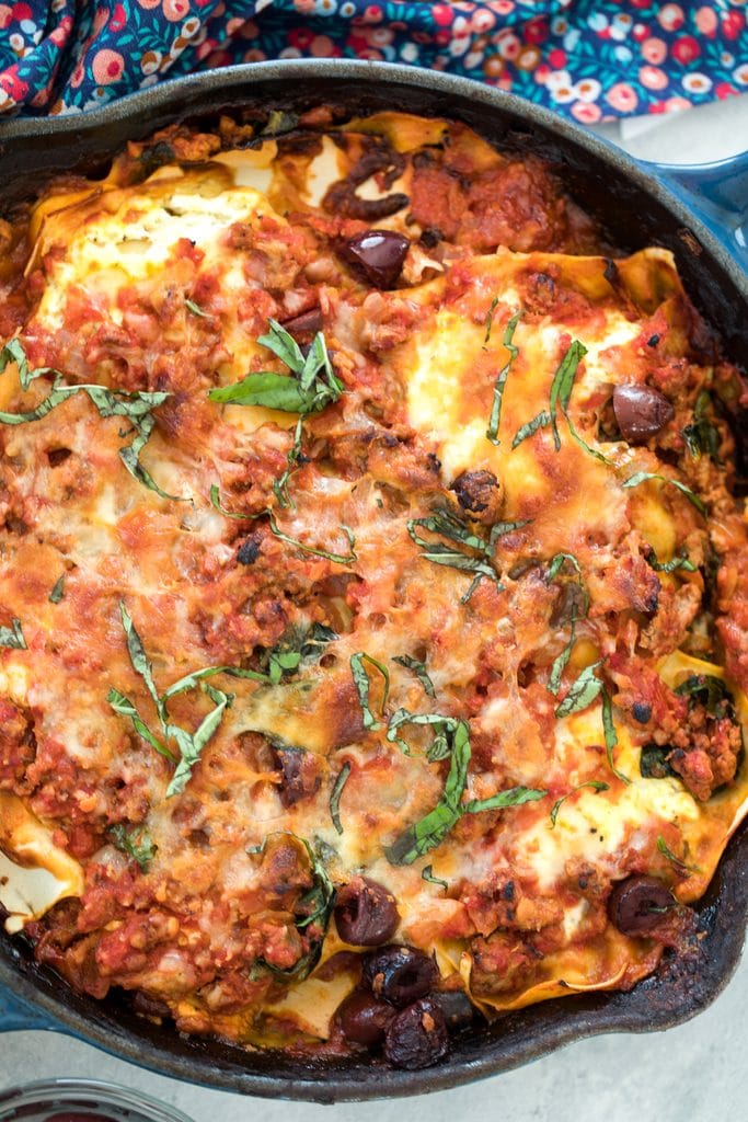 Overhead close-up of Greek lasagna in a skillet