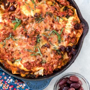 Greek Skillet Lasagna -- This lasagna is packed with Greek flavors, including ground lamb, feta, and kalamata olives, for a fun and easy-to-make (and cleanup!) twist on traditional lasagna | wearenotmartha.com