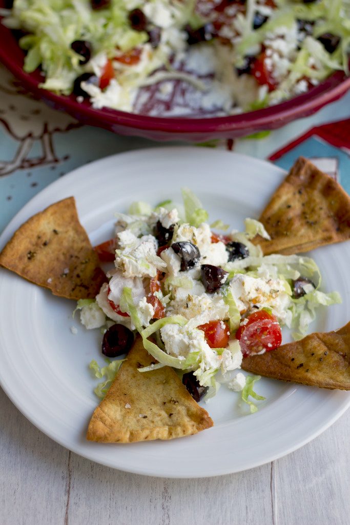 Greek Taco Dip with Black Peppercorn Pita Chips -- The perfect alternative to a party taco dip | wearenotmartha.com