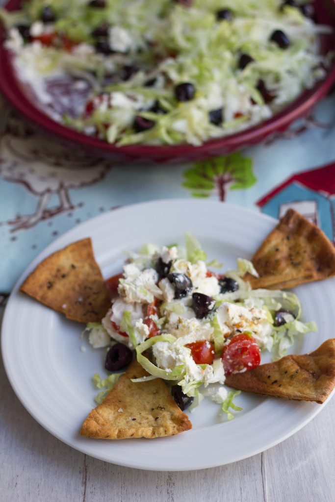 Greek Taco Dip with Black Peppercorn Pita Chips -- The perfect alternative to a party taco dip | wearenotmartha.com