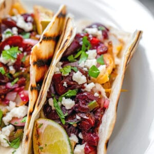 Fire up the grill for these Grilled Cod Tacos! Not only is the fish grilled, but nearly everything in the tacos is, including the grilled cherry salsa!