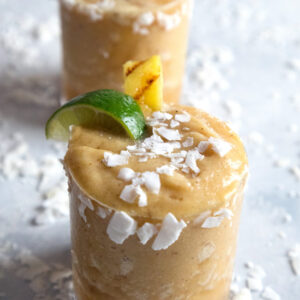 Grilled Pineapple Coconut Margaritas -- This frozen margarita combines grilled pineapple, coconut water, lime juice, and tequila for a delicious tropical cocktail | wearenotmartha.com