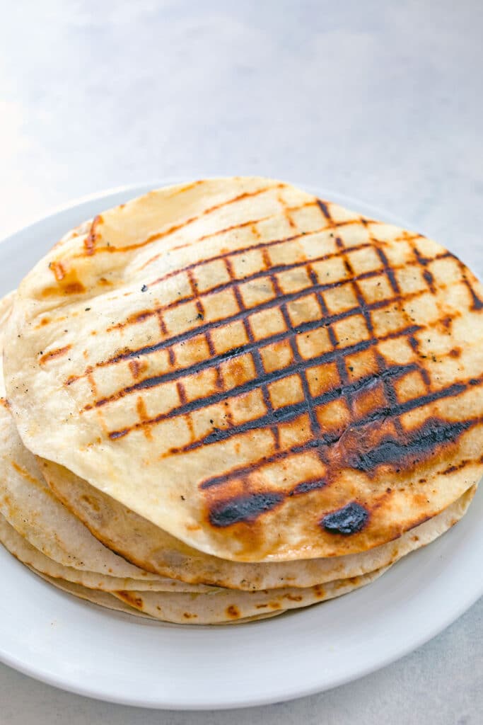 Overhead of flour tortillas with criss-cross grilled marks