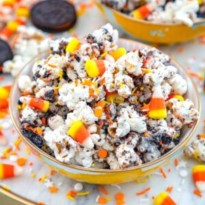 Halloween Party Popcorn -- This Halloween Party Popcorn is a delicious mix of popcorn, white chocolate, Oreo cookies, candy corn, and sprinkles... It's easy to make and always a big crowd pleaser! | wearenotmartha.com