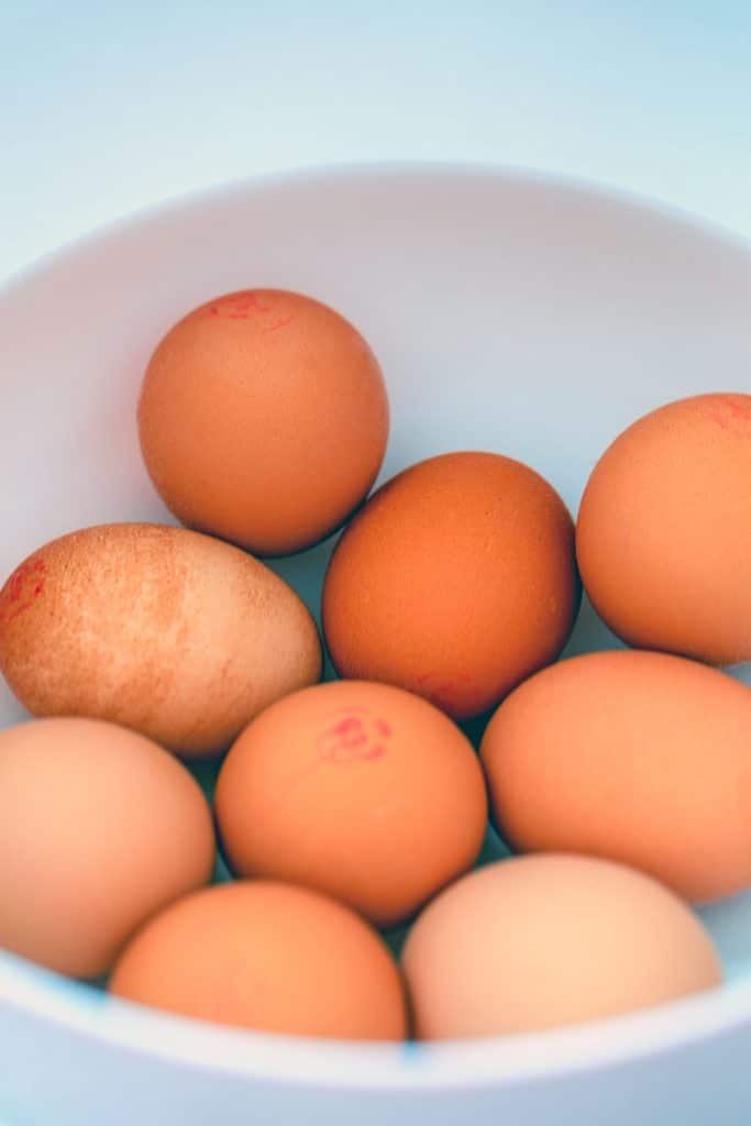 Hardboiled eggs sitting in cold water bath