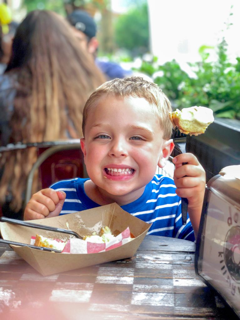 Henry looking super happy while eating his gelato donut at Chicago's BomboBar