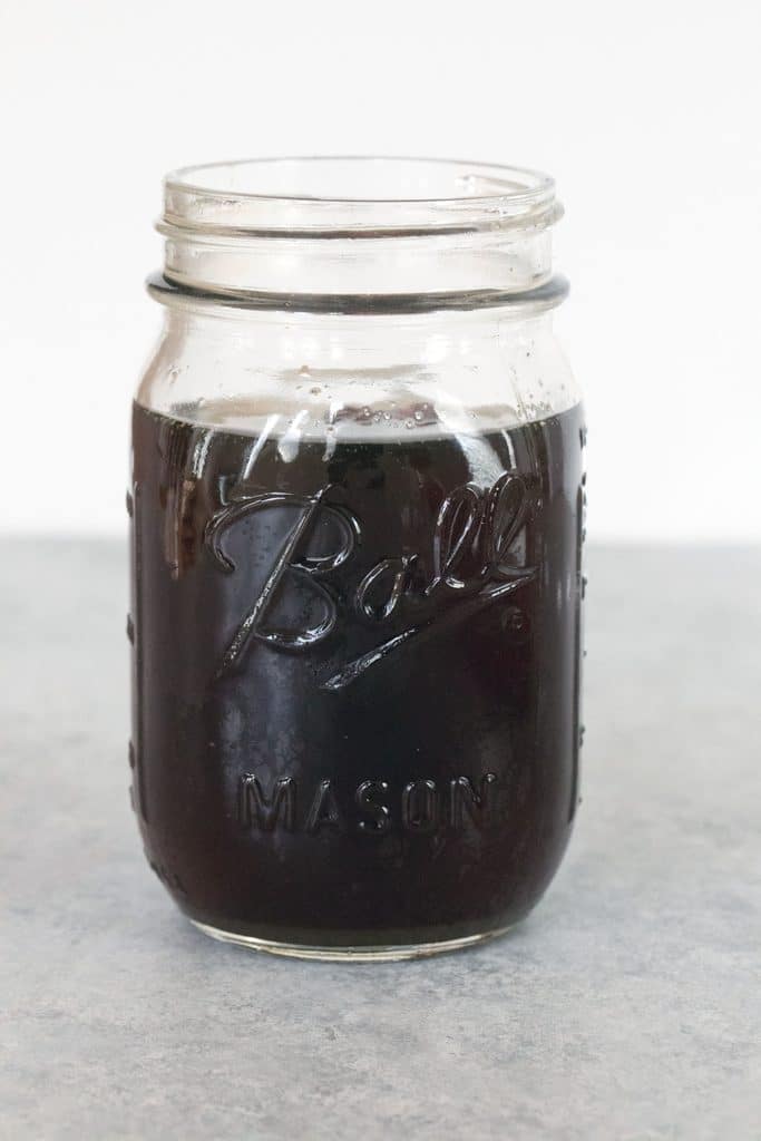 Head-on view of a jar of holiday spiced simple syrup