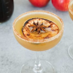 Holiday Spiced Honeycrisp Apple Cocktail -- Honeycrisp apples combine with a holiday spiced simple syrup and bourbon for the perfect holiday apple cocktail. Don't forget the cinnamon sugar rim | wearenotmartha.com