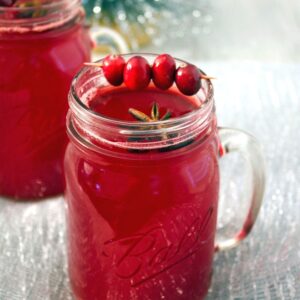 Hot Spiced Cranberry Cocktail -- Baby, it's cold outside. And you should be drinking your cranberry cocktail warm with plenty of seasonal spices and vodka. This is the perfect holiday drink and will warm you right up | wearenotmartha.com