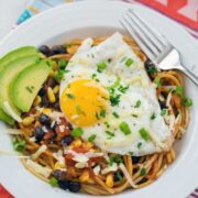 Huevos Rancheros Spaghetti -- Spaghetti for breakfast? Totally acceptable if it's this Huevos Rancheros Spaghetti dish! Extremely easy to make for either brunch or dinner, there's a good chance you have all the ingredients in your pantry right now | wearenotmartha.com