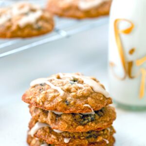 Oatmeal Applesauce Cookies -- These Iced Oatmeal Applesauce Cookies are packed with oats, applesauce, and two types of raisins, for the most delightfully chewy oatmeal cookie around! Drizzle them with a maple icing and just try not to eat the whole batch in one sitting | wearenotmartha.com