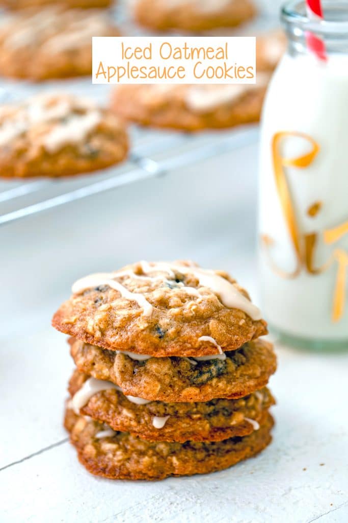Head-on view of a stack of four oatmeal applesauce cookies with maple glaze with a rack of more cookies and a bottle of milk in the background and "Iced Oatmeal Applesauce Cookies" text at the top