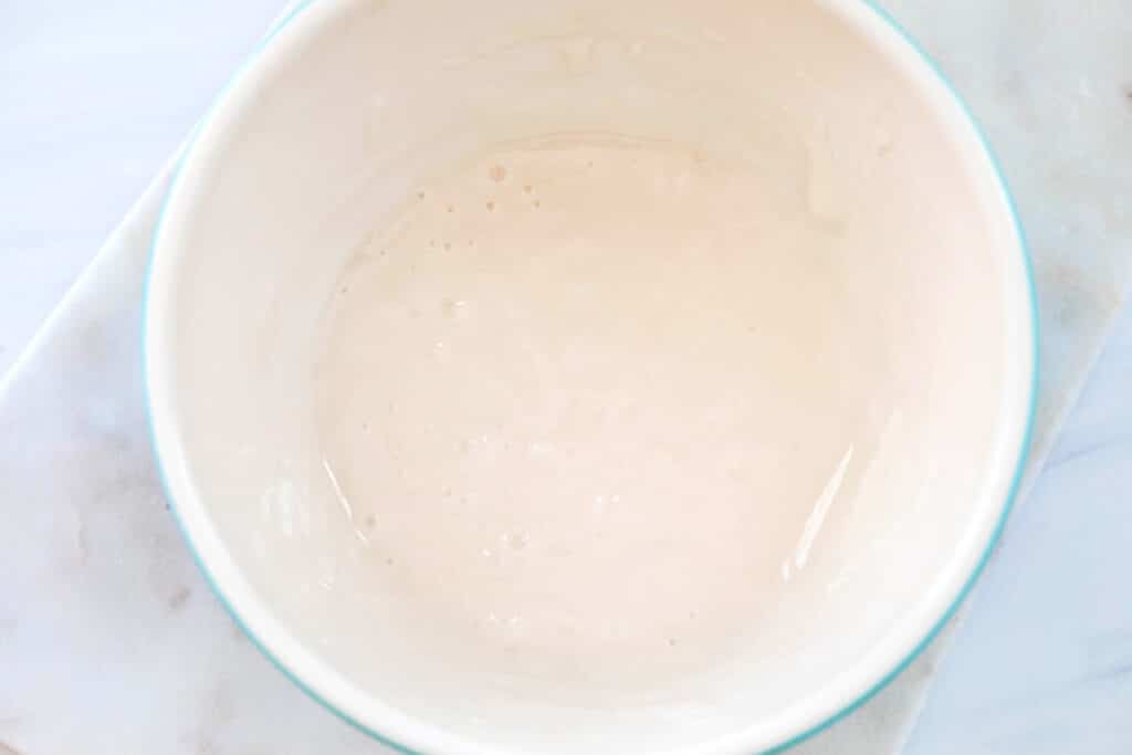 Vanilla icing in small bowl.