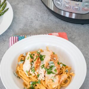 Instant Pot Buffalo Chicken Pasta -- With this Buffalo Chicken Pasta in the Instant Pot, dinner will be ready in no time at all... And you won't be left with a sink full of dirty dishes! | wearenotmartha.com