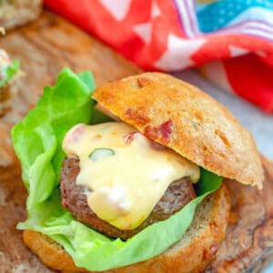 Jalapeño Queso Burgers on Bacon Rolls -- These Jalapeño Queso Burgers are a dream come true! The spicy beef burgers are topped with jalapeño queso and served on homemade bacon rolls and will quickly become the best burger you've ever had | wearenotmartha.com