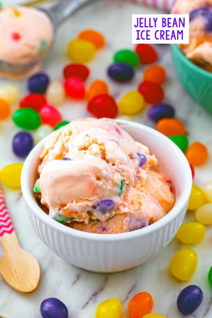 Overhead view of a bowl of jelly bean ice cream with jelly beans all around and recipe title at top.