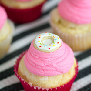 Jelly Doughnut Cupcakes -- What's better than a jelly doughnut? A jelly doughnut in cupcake form! These Jelly Doughnut Cupcakes don't require frying and have the added bonus of vanilla buttercream in addition to the sugar topping | wearenotmartha.com