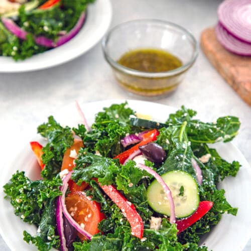 Kale Greek Salad -- Thanks to lots of fresh vegetables, kalamata olives, and feta cheese, a Greek salads is always delicious. But a Kale Greek Salad is both delicious and extra healthy! | wearenotmartha.com