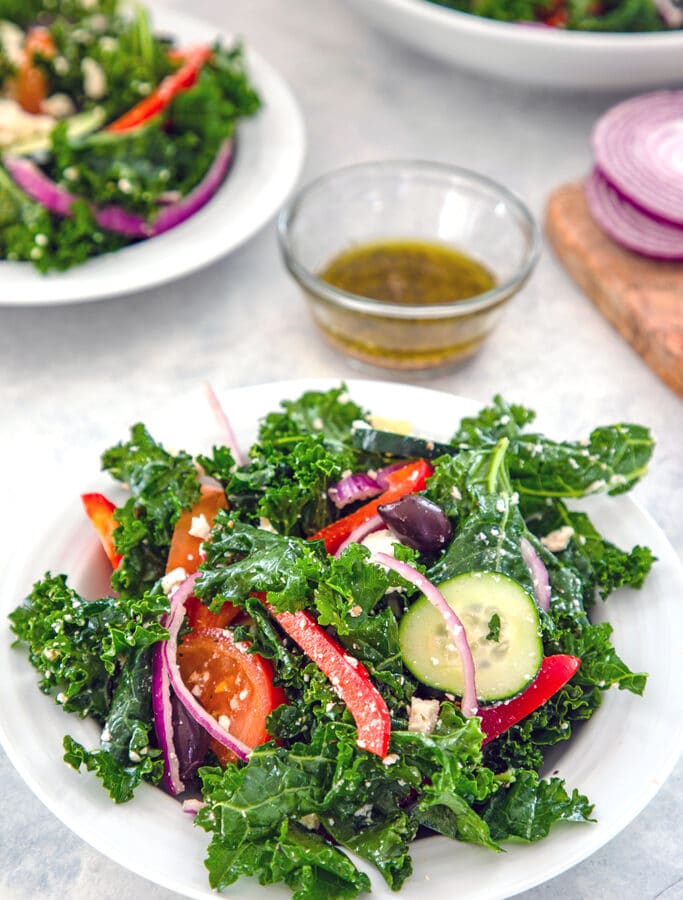 Kale Greek Salad -- Thanks to lots of fresh vegetables, kalamata olives, and feta cheese, a Greek salads is always delicious. But a Kale Greek Salad is both delicious and extra healthy! | wearenotmartha.com