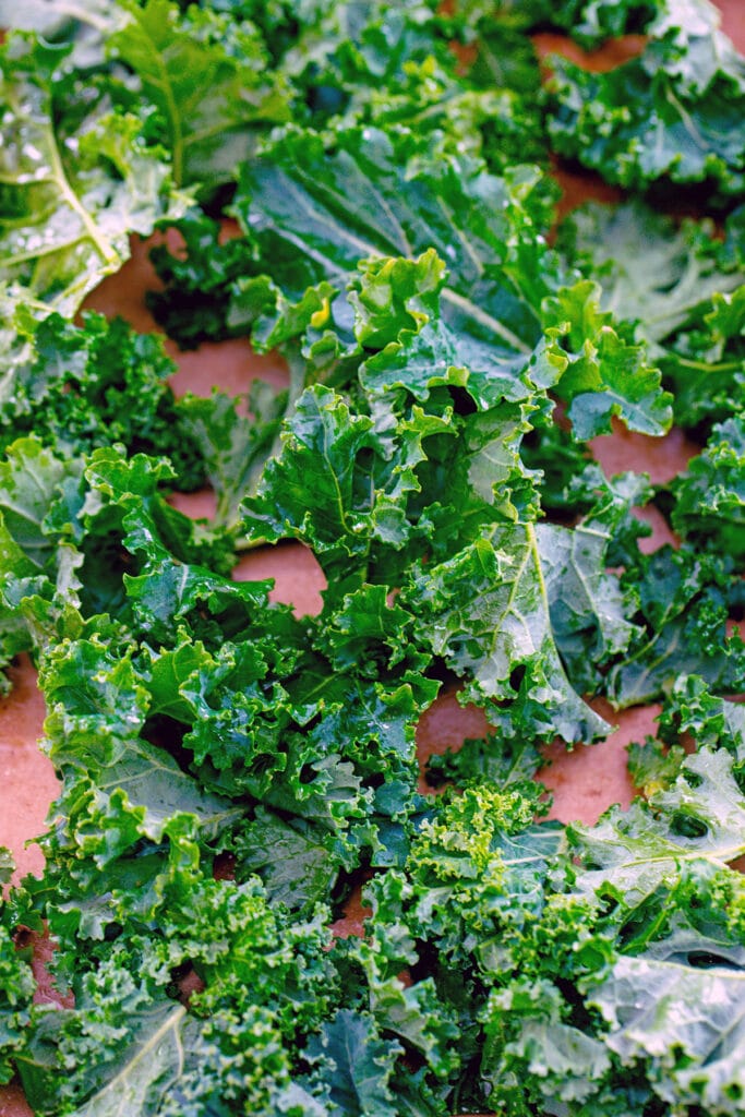Overhead view of kale on baking sheet