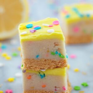 These no-bake Lemon Cookie Dough Bars have a lemon Oreo crust, a lemon cookie dough middle, and a buttercream frosting topping. They're packed with bright lemon flavors and are a melt-in-your-mouth delectable treat!