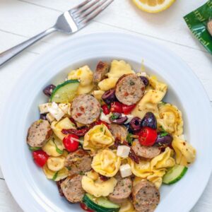 Lemon Tortellini Salad with Chicken Sausage -- This dish is incredibly easy to prepare and much heartier than your typical pasta salad. It's perfect for a low-key summer dinner, but also makes an excellent dish to bring to a BBQ or summer party | wearenotmartha.com