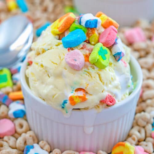 Close-up view of a bowl of Lucky Charms Ice Cream topped with cereal marshmallows over a bed of Lucky Charms