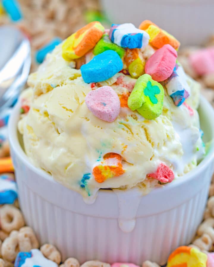 Close-up view of a bowl of Lucky Charms Ice Cream topped with cereal marshmallows over a bed of Lucky Charms