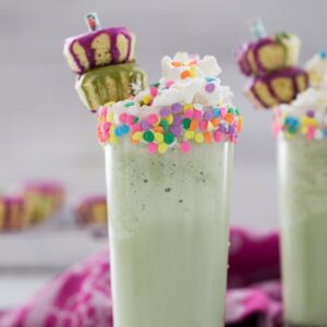 Matcha Milkshakes -- With only three ingredients, you could be enjoying a Matcha Milkshake, packed with antioxidants and creamy sweetness, in just minutes. Add whipped cream, sprinkles, and mini donuts for some extra fun | wearenotmartha.com