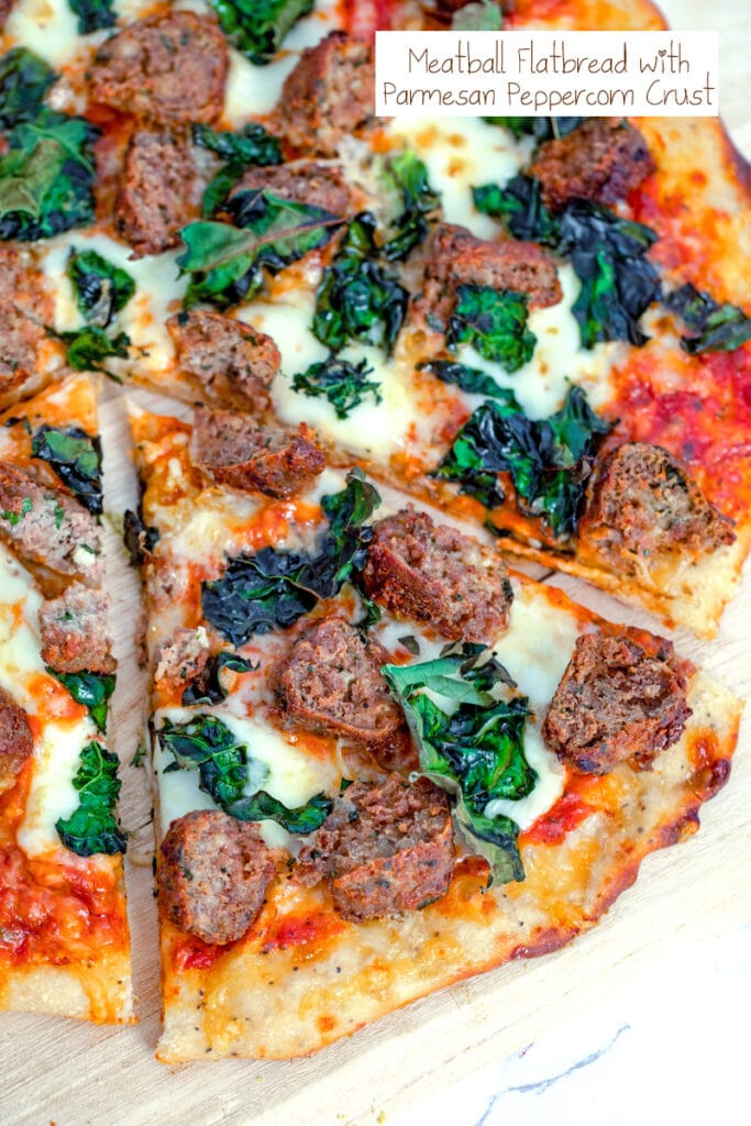 Overhead view of a slice of meatball flatbread with cheese and kale pulled out from the rest of the pizza with recipe title at top