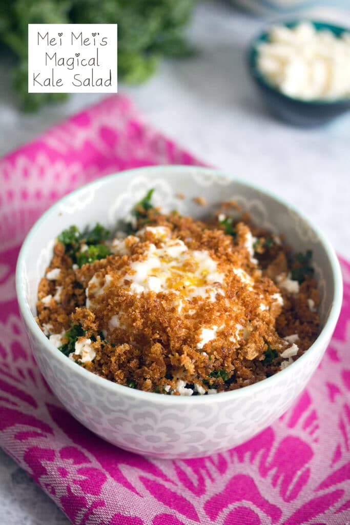 Head-on view of Mei Mei's magical kale salad with panko and soft boiled fried egg with feta and more kale in background and recipe title at top