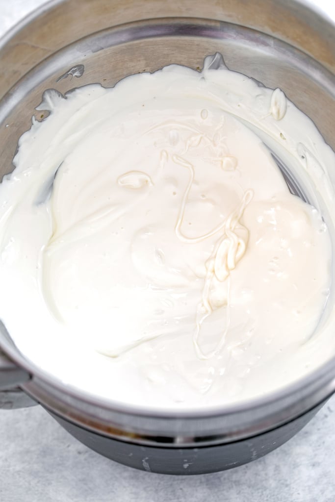 Overhead view of white chocolate melted in double boiler.