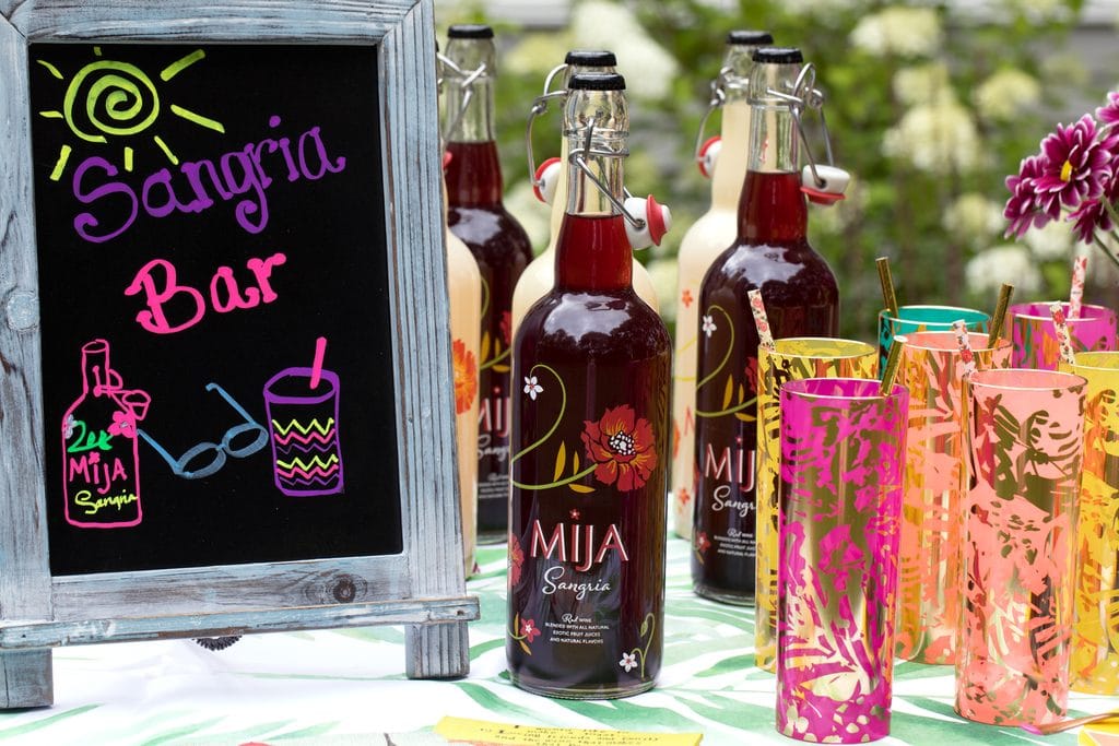 DIY Sangria Bar -- Use Mija Sangria, fresh fruit, and some fun accessories for your own fun summer sangria bar! | wearenotmartha.com