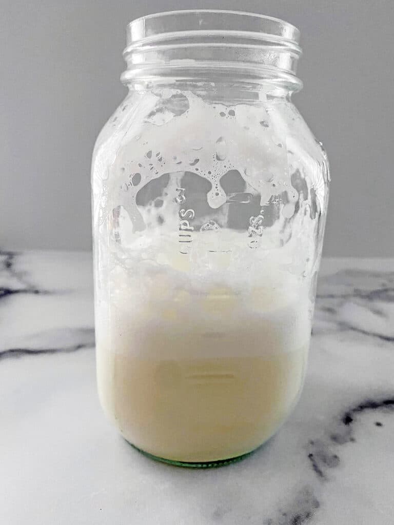 Milk in mason jar shaken and steamed.